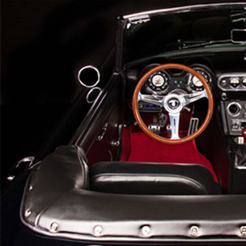 CalSpyder Black Interior with Red Floor Mats, driver's side